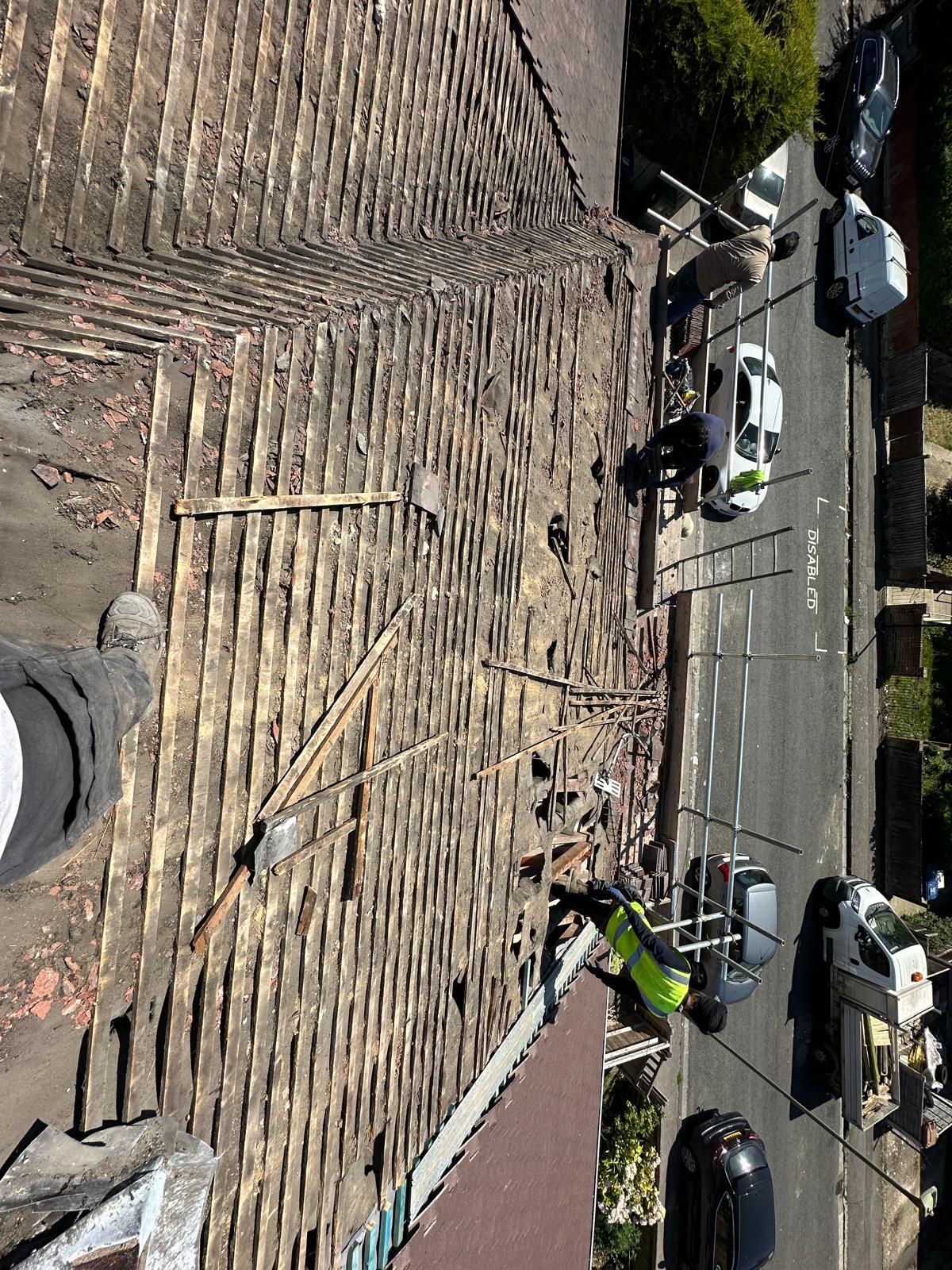Gaps and slipped slates on a Bristol roof