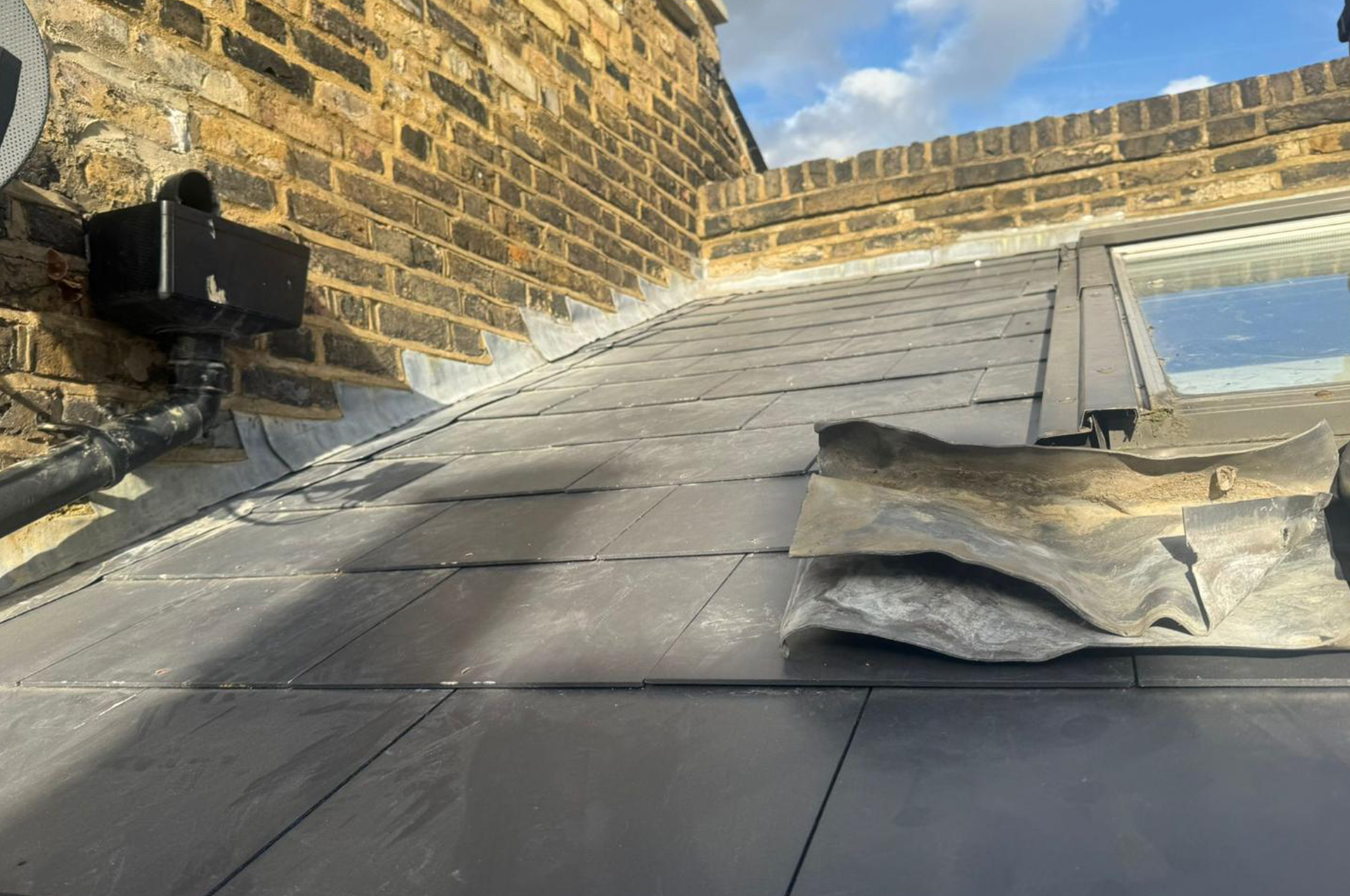 Full slate re-roof in progress in Bristol