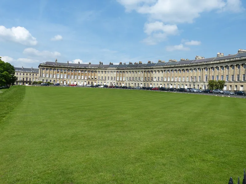 The long curved Georgian terrace of the Royal Crescent in Bath seen across its lawn